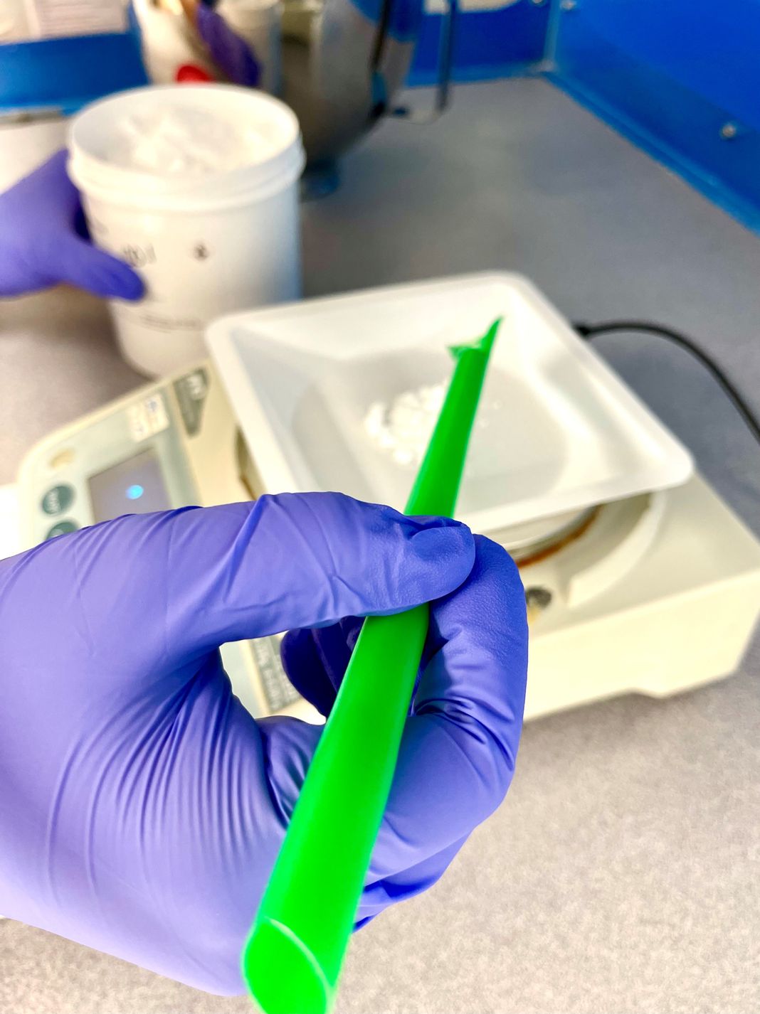 Pharmacist preparing a compounded medication in the pharmacy lab