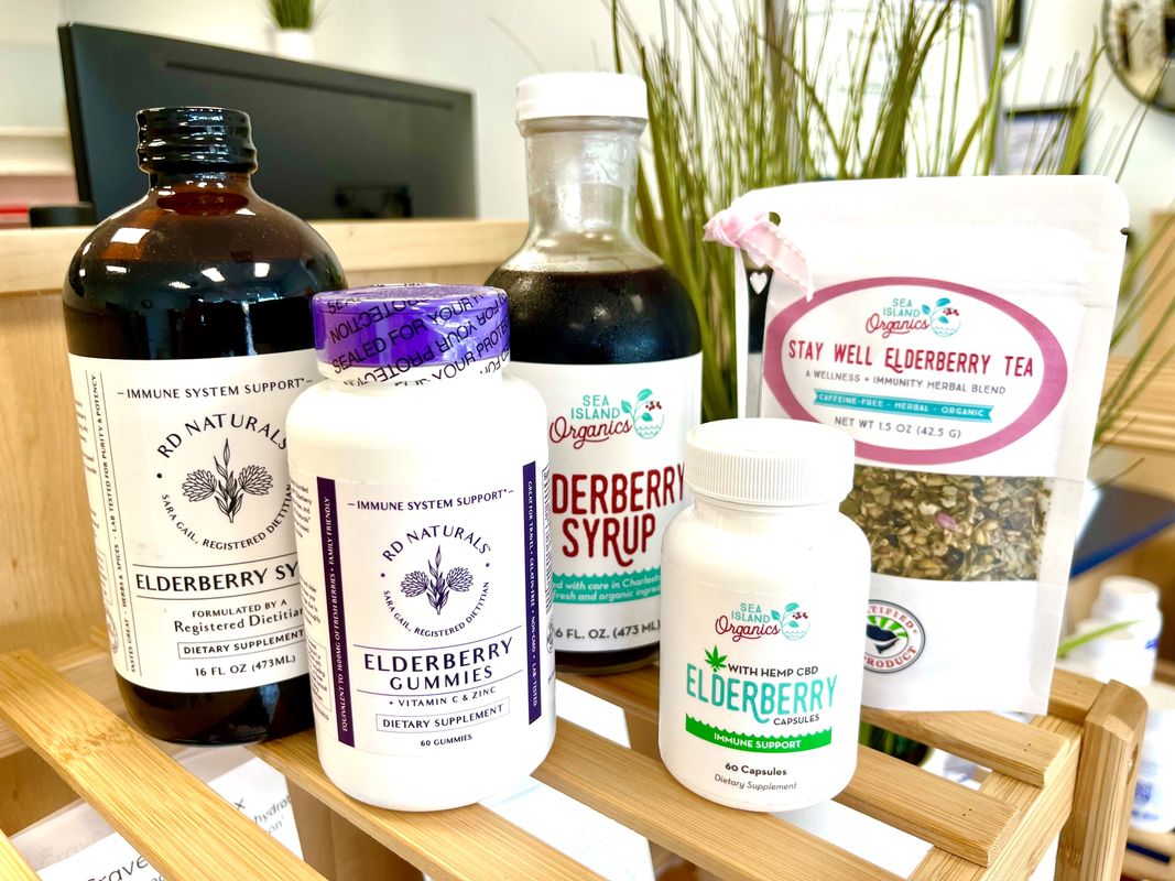 Elderberry syrup, gummies, capsules and tea display in the store